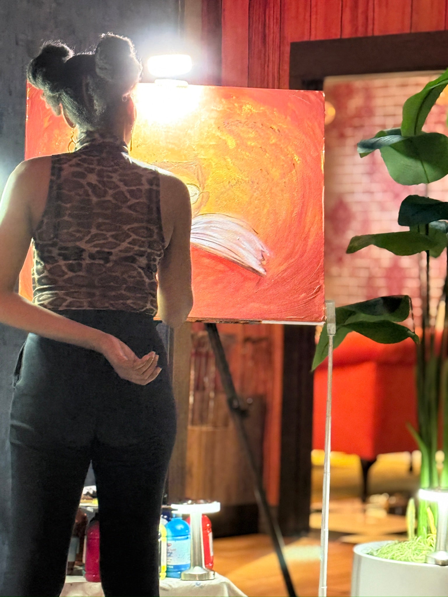 Live painting experience at Puttery in Wynwood miami neighborhood. live entertainment night. Art by artist Ashley mullen ashmcc crafts miami los angeles california florida. Black girl painting afro puffs